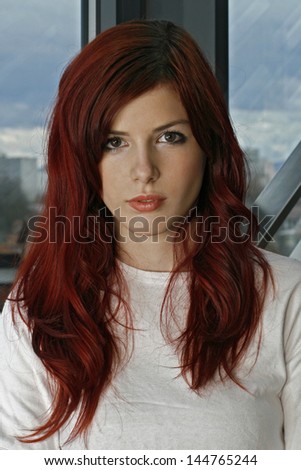 beautiful young business woman with red hair