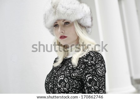 image of young woman with winter hat, a rich young woman with fur hat, the Russian beauty on white background, young woman in warm clothing fur hat