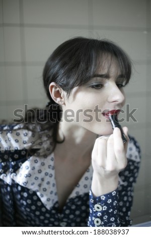 photo of production make up , beautiful girl is having a production of her make up, film production, actress