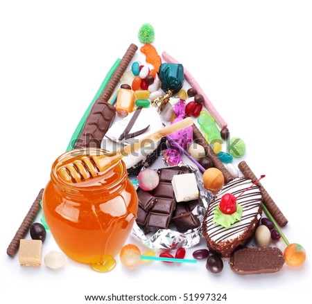 Pyramid in the form of sweets. Isolated on white
