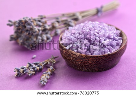 Sea-salt and dried lavender on a violet background.