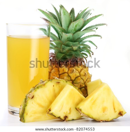 Pineapple juice in a glass of pineapple slices. Image on white background.