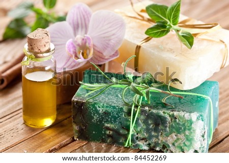 Pieces of natural soap with herbs and oil.