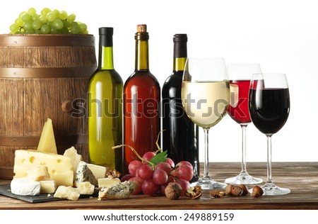 Still-life with wine, cheeses and fruits on white background.
