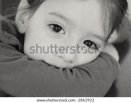 close black and white portrait - some grain - little girl with big eyes