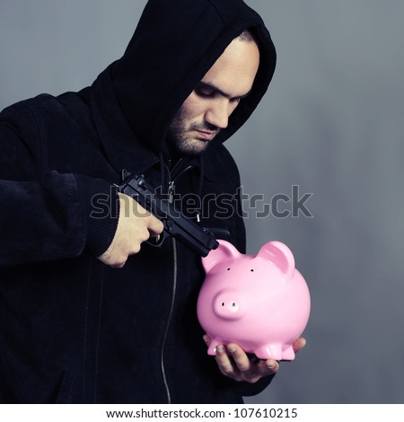 bad guy with pink piggy bang and gun in the hand
