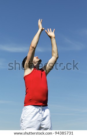 goal raising hand to heaven to catch the ball