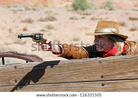 woman with a gun in the hand