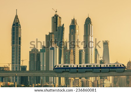 DUBAI, UAE - NOVEMBER 28: View of modern buildings with subway at sunset in Dubai Marina, Dubai, UAE. Taken on 28 November 2014 in Dubai.