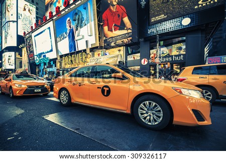 NEW YORK CITY - JULY 10: Taxi on Times Square, an iconic street of New York City and America, July 10, 2015 in Manhattan, New York City. Special photographic processing
