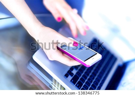 Girl use smart phone and laptop