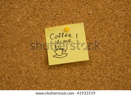 Adhesive paper note on cork board with words Coffee time