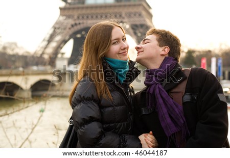 Happy loving couple in Paris near the Eiffel Tower