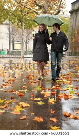 Dating couple in Paris at rain