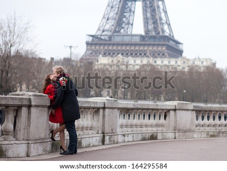Romantic couple in love in Paris, near the Eiffel tower