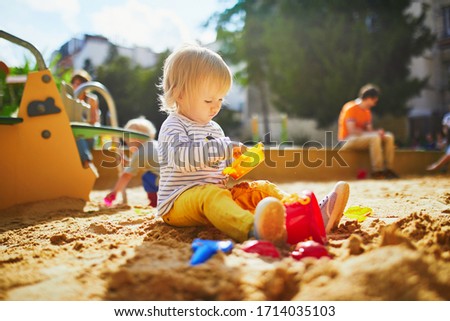 Similar – Image, Stock Photo Toddler playing at playground
