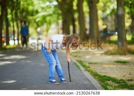 Similar – Image, Stock Photo Child with a stick at the water