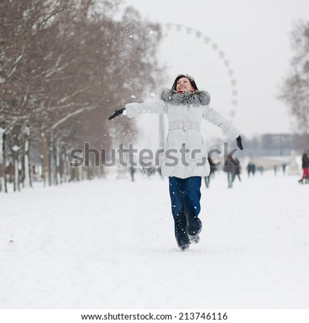 Cheerful young girl enjoying beautiful winter day in Paris
