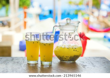 Jug of fresh papaya juice with two glasses