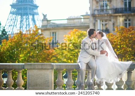 Happy just married couple in Paris on a fall or spring day
