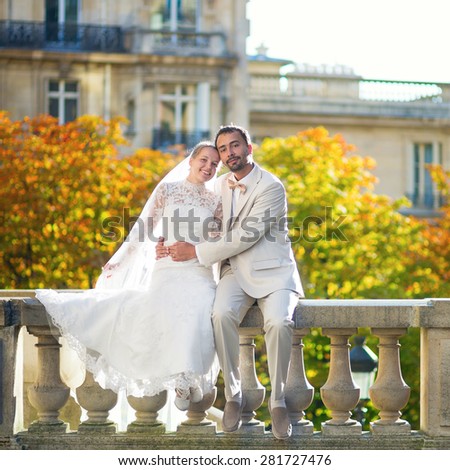 Happy just married couple in Paris on a fall day