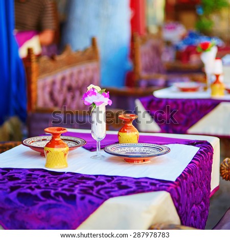 Table set for dinner in traditional Moroccan street restaurant
