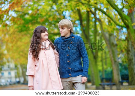 Young romantic couple in Paris, enjoying beautiful autumn day