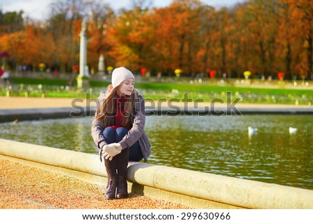 Girl enjoying sunny autumn day in Paris