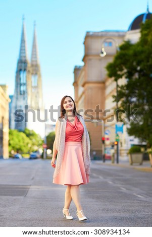 Beautiful young tourist walking in the street in Vienna, Austria