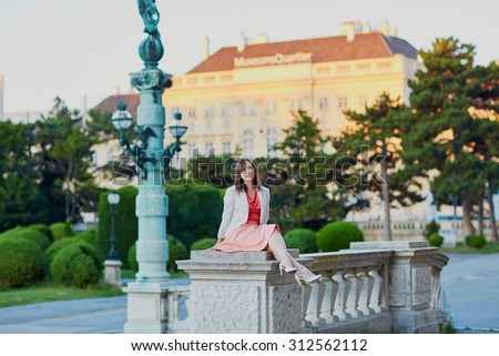 Beautiful young woman walking alone in Vienna, Austria