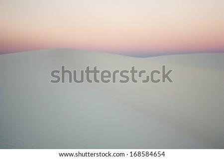 Dusk over gypsum sand dune shapes in White Sands National Monument, New Mexico