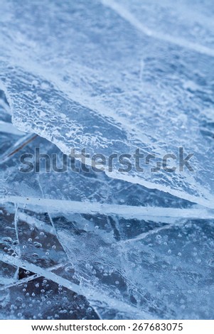Ice washed up on lake shore like shards of glass, Lofoten, Norway