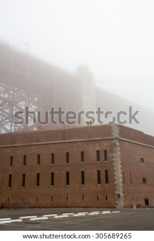 Golden Gate Bridge and Fort Point on a foggy summer\'s morning