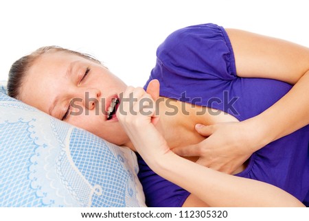 girl asleep in the bed isolated on white background