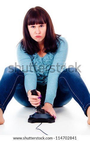 beautiful girl gets angry, plays video games isolated on white background