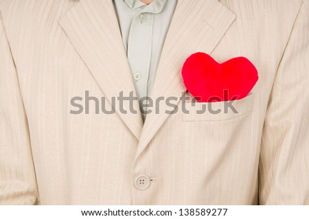 the heart is in the pocket of the suit isolated on white background
