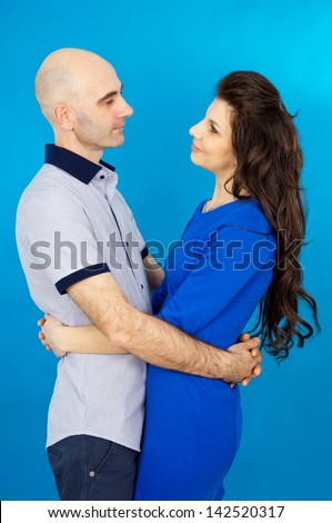 Beautiful couple in love on a blue background