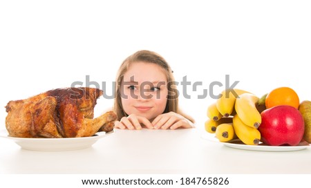 Beautiful girl peeking over the cooked chicken isolated on white background