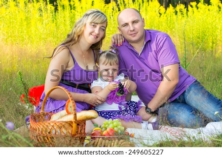 Happy married couple on nature, picnic