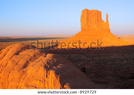 Mitten mesa lit by setting sun in Monument Valley, Navajo Nation, Utah