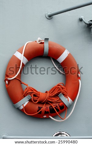 View of a red life saver buoy on a boat.