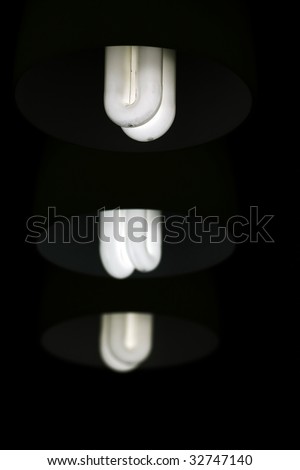 View of three lamps lit and aligned on the vertical.