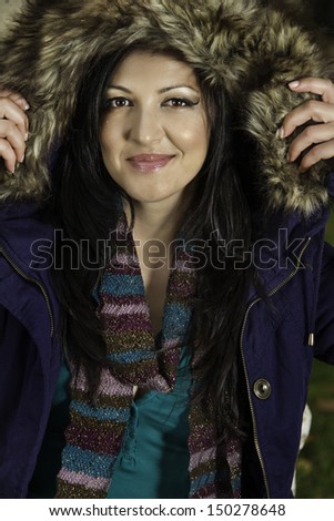 Young beautiful woman with big hairy winter jacket.