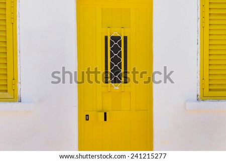 Close up view of a modern yellow aluminum window and door.