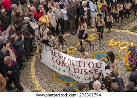 SAO BRAS DE ALPORTEL, PORTUGAL - April 5th, 2015: Traditional religious procession of the flower torches event located in village of Sao Bras de Alportel, Portugal.