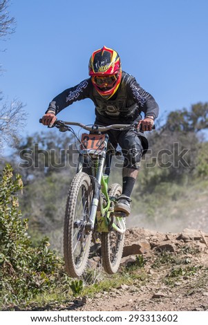PORTUGAL - SAO BRAS DE ALPORTEL, March 15th 2015: 1st stage - Portuguese Cup - Downhill competition, Biker rides fast in the countryside.