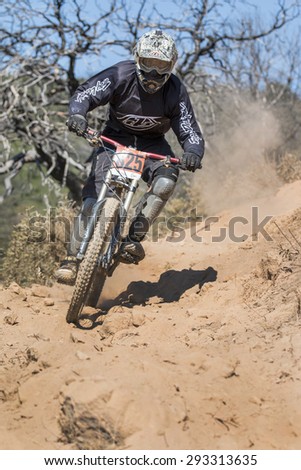 PORTUGAL - SAO BRAS DE ALPORTEL, March 15th 2015: 1st stage - Portuguese Cup - Downhill competition, Biker rides fast in the countryside.