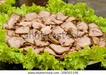 a dish made from pig tongue cooked with special ingredients. This food contain high cholesterol and not recommended for  people who have heart disease