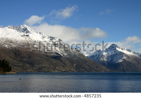 Lake wakatipu near Queenstown - South Island New Zealand. Snow covered mountains in the background. A popular tourist destination.