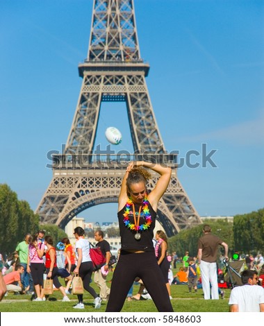 Paris, September 2007, girl stretching after marathon of 6,5 km around Tour Eiffel